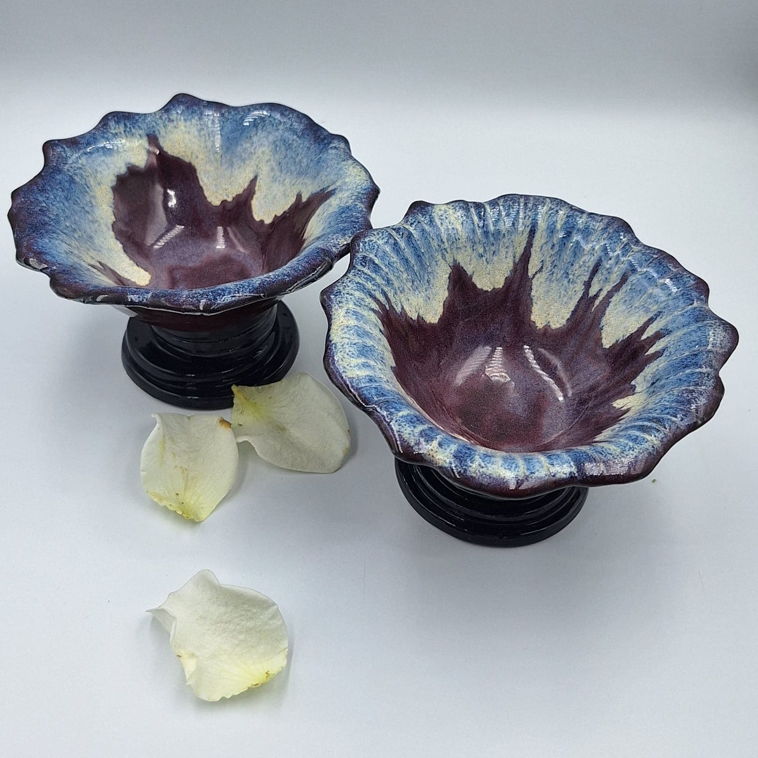 Collection of handcrafted ceramic pieces with botanical designs